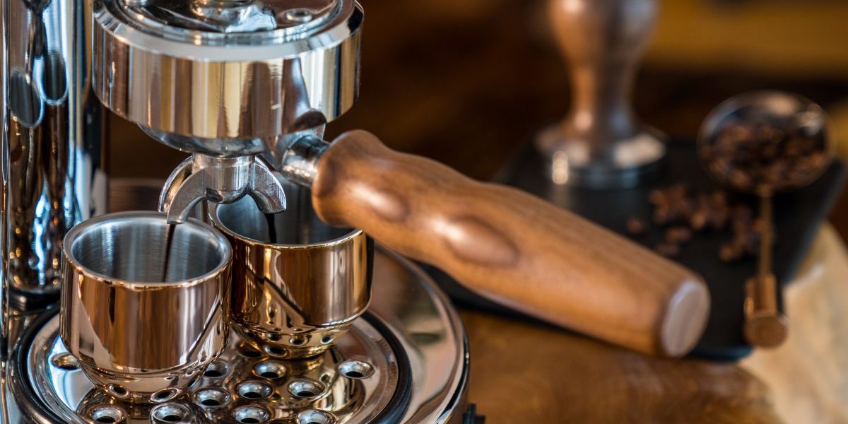 Pouring fresh espresso with high end Barista Espresso Machine at home Pouring fresh espresso with high end Barista Espresso Machine at home